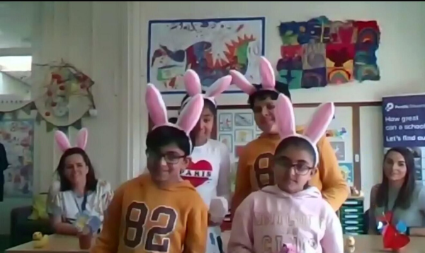 Pupils show The Duke and Duchess of Cambridge their Easter bunny ears