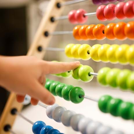 child playing with abacus