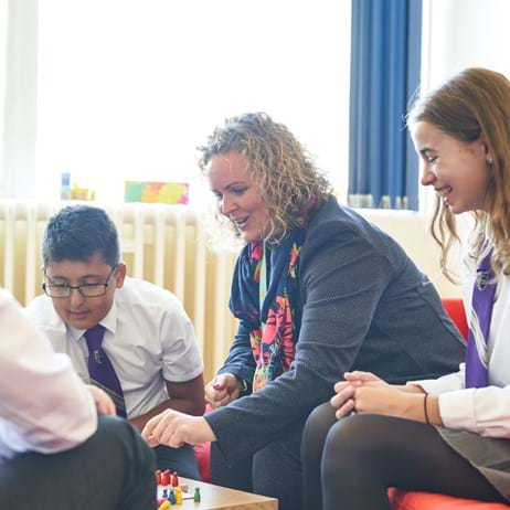 Counsellor with children playing game