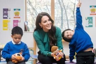 The Princess of Wales, Place2Be's Royal Patron, sitting with primary school pupils in a classroom