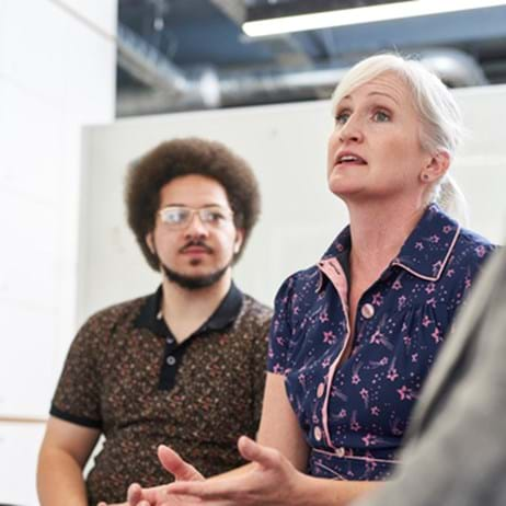 two people in discussion